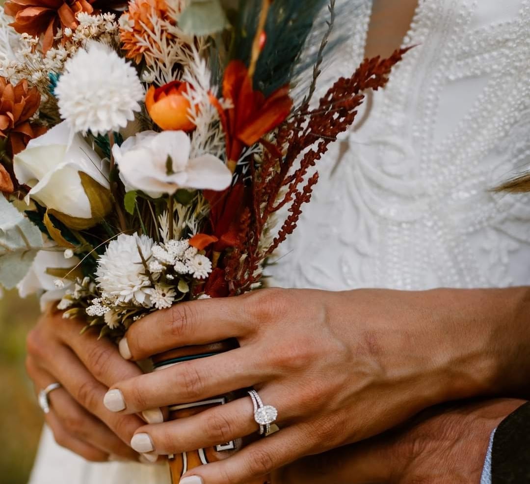 hands holding flower